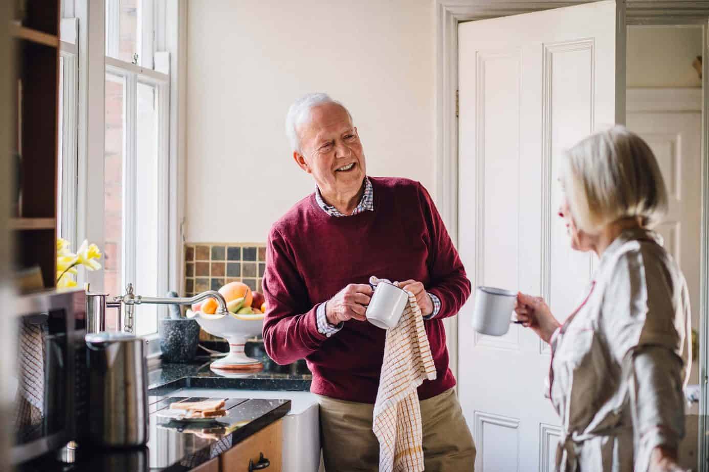 Happy Seniors Couple In The Kitchen