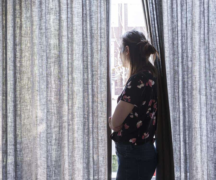 Lady looking out her window