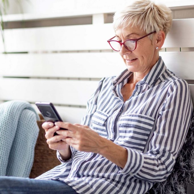 senior woman researching on phone-v1 senior woman researching on phone