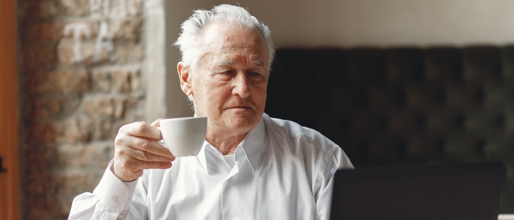 Elder pensioner using a laptop